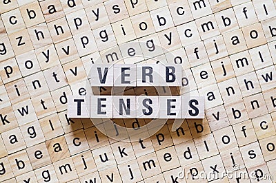 Verb tenses word concept on cubes Stock Photo