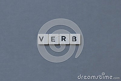 ' Verb ' word made of square letter word on grey background Stock Photo