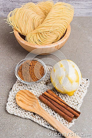 Vermicelli pasta nests in wooden boowl Stock Photo