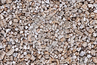 Vermiculite background. Exfoliated perlite and vermiculite texture background. Mineral used in gardening. Stock Photo