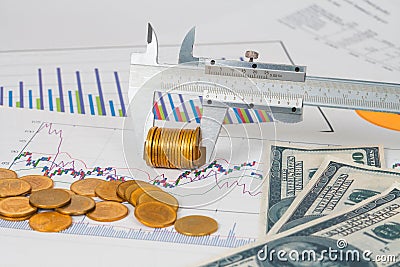 Vernier measuring money coin on business chart ,business Stock Photo