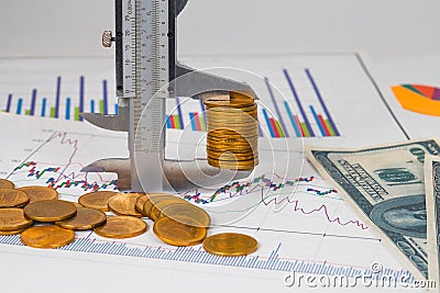 vernier measuring money coin on business chart ,business Stock Photo