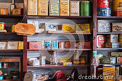 Tins of vintage dry goods displayed on store shelves Editorial Stock Photo