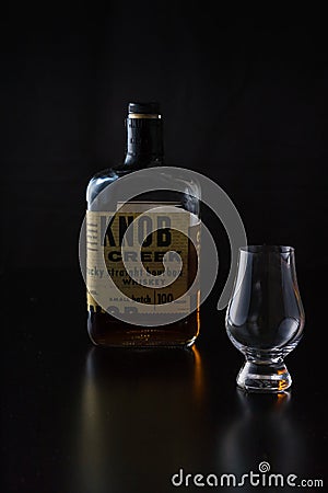A glencairn glass with a 100 proof kentucky straight boubon whiskey Editorial Stock Photo