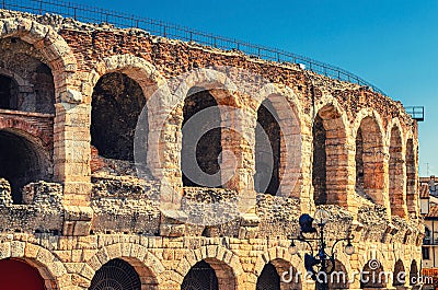 The Verona Arena limestone walls with arch windows in Piazza Bra square Stock Photo