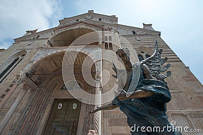 Verona Cathedral exterior and a bronze angel inviting visitors Stock Photo