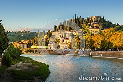 Verona cityscape during late sunset with Adige river and Church Editorial Stock Photo