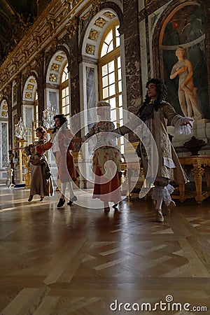 VERSAILLE FRANCE: Historical reenactors at the Chateau de Versailles, the estate of Versaille was the home and court of Louis XIV Editorial Stock Photo