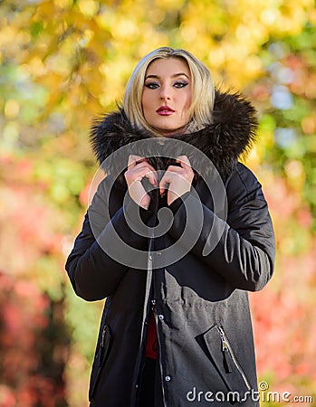 Versatile functional and stylish. Girl wear parka while walk park. Autumn season fashion concept. Puffer jacket with Stock Photo