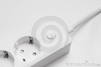 a versatile modern white extension cord with sockets Stock Photo