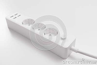 a versatile modern white extension cord with sockets and usb ports Stock Photo