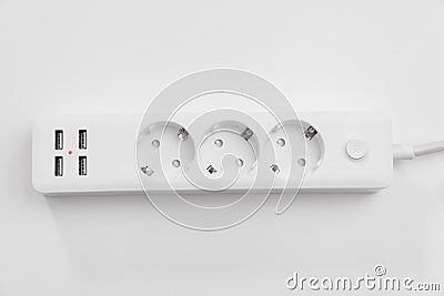 a versatile modern white extension cord with sockets and usb ports Stock Photo