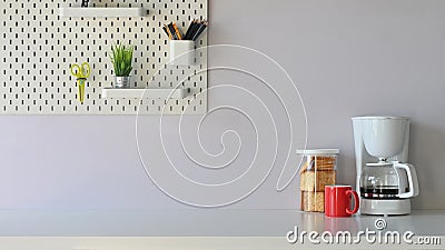 Versatile table in the morning vibe including coffee maker, coffee cup, biscuits is on the table potted plant. Stock Photo