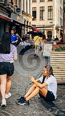 Vertcial shot of people and tourists exploring the cultural city of Brussels, Belgium Editorial Stock Photo