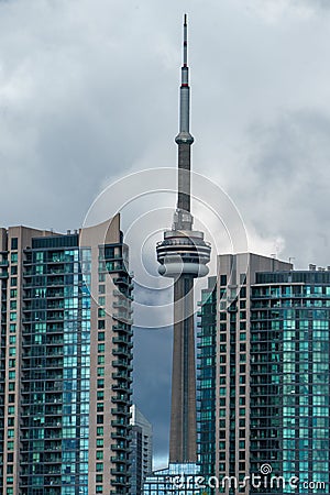 Vertical aerial shot of CN Tower in Toronto under cloudy sky Editorial Stock Photo