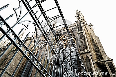 Vertical aspect of a protective, metal spiked gate seen at the entrance to an English cathedral in East Anglia. Stock Photo