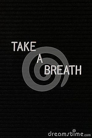 Vertical black spongy board with a text "take a breath" for background Stock Photo