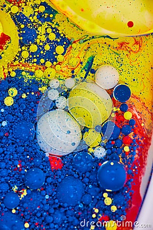 Vertical of bubbling blue white yellow and red abstract painting of background Stock Photo