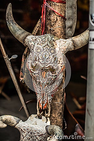 Vertical close-up of carved bull skull Stock Photo