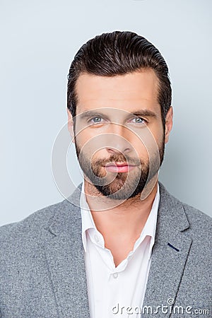 Vertical close up portrait of serious young minded man in white Stock Photo