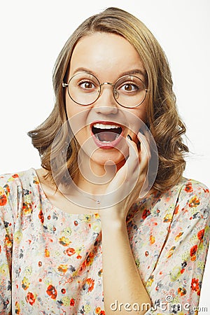 Vertical close-up portrait of young woman with vivid emotion surprise, opened mouth, eyes wide open, expresses surprise Stock Photo