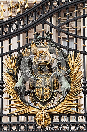 Vertical close-up view of golden Buckingham Palace gates. Editorial Stock Photo