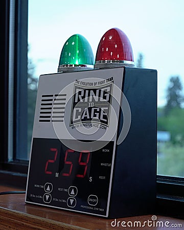 Vertical closeup of an electronic boxing bell with a countdown timer on a windowsill Editorial Stock Photo