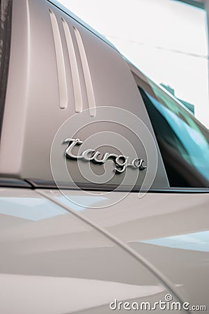 Vertical closeup on a Porsche 911 Targa B pillar badge Editorial Stock Photo