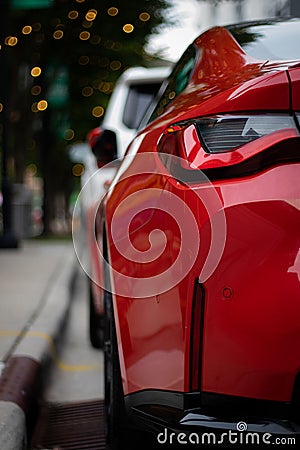 Vertical closeup of a red modern car taillights Stock Photo