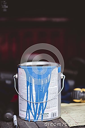Vertical closeup shot of a bucket of blue paint Stock Photo