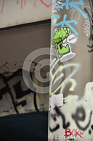 Vertical closeup shot of a graffiti and sticker on lanternon Tesnov Street in Prague, Czech Republic Editorial Stock Photo