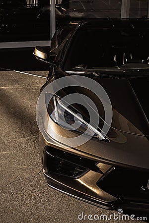 Vertical closeup shot of a silver modern Bentley Bentayga 2022 Hybrid badge Editorial Stock Photo