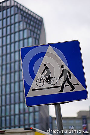 Vertical closeup shot of a square road sign indicating the passage for pedestrians and cyclists Stock Photo