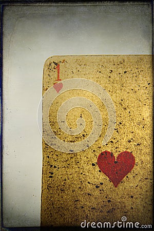 Vertical closeup shot of a worn-out playing card of hearts - perfect for background Stock Photo