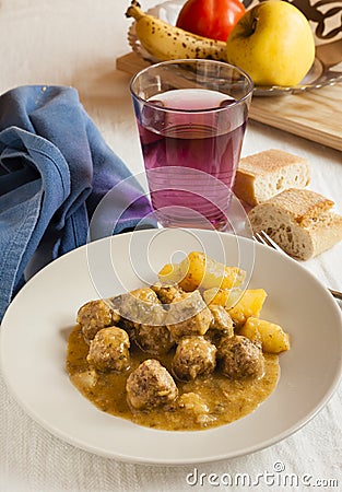 Moroccan kefta tajine meatballs on served on a table. Stock Photo