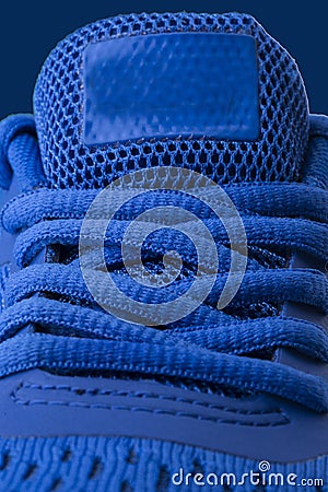 Vertical fragment of blue sneaker close up Stock Photo