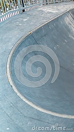 Vertical frame Conctere skate park with close view of the bowl shaped skating ramp Stock Photo