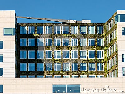 Vertical garden on modern building in Amsterdam Editorial Stock Photo