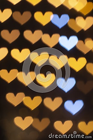 Vertical golden bokeh hearts background. Stock Photo