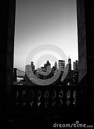 Vertical grayscale shot of the NYC skyline at night Editorial Stock Photo