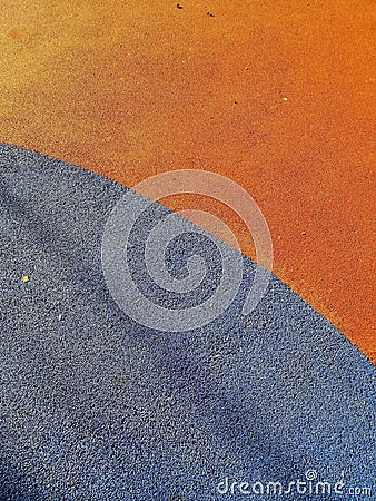 Vertical high angle shot of the orange and grey ground in the playground Stock Photo