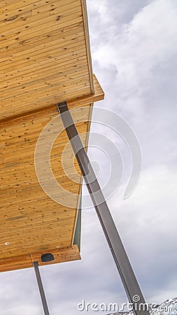 Vertical House with roof extending beyond the stairs that leads to the entrance Stock Photo