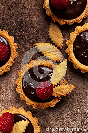 Vertical image of Salted Chocolate Mini Tarts with chocolate ganache cream Stock Photo