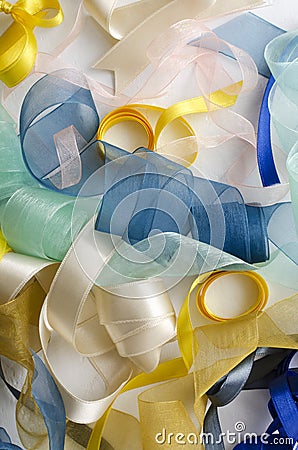 Vertical image. Top view of various types of ribbons on the white surface Stock Photo