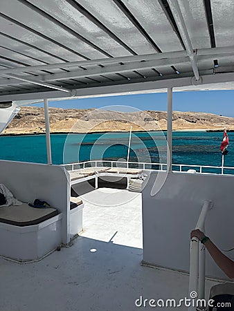 Vertical of the interior of a boat on a blue sea on a sunny day Stock Photo