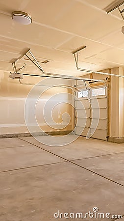 Vertical Interior of the empty garage of a home with unfinished walls and ceiling Stock Photo