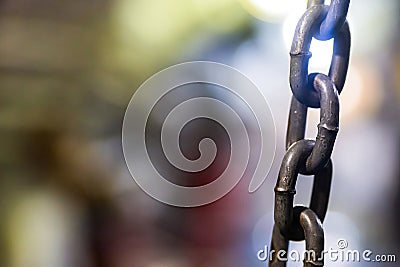 Vertical iron chain grunge background stretched rigid base on bl Stock Photo