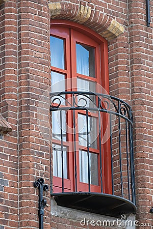 Vertical low-angle view of a vintage balcony of a brick-built building Stock Photo
