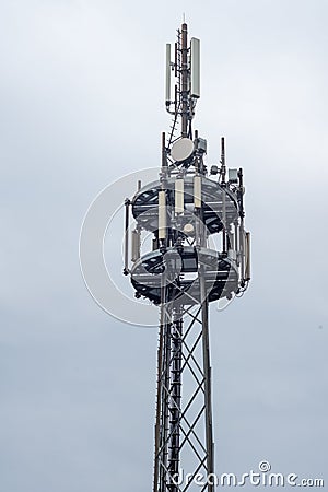 Vertical of a metallic antenna tower with broadcasters Stock Photo