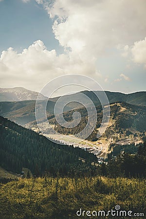 Vertical mountain landscape in summer in bukovel on mountains, forest and buildings Stock Photo